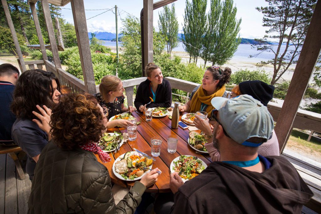People gathered at Hollyhock's retreat centre restaurant.