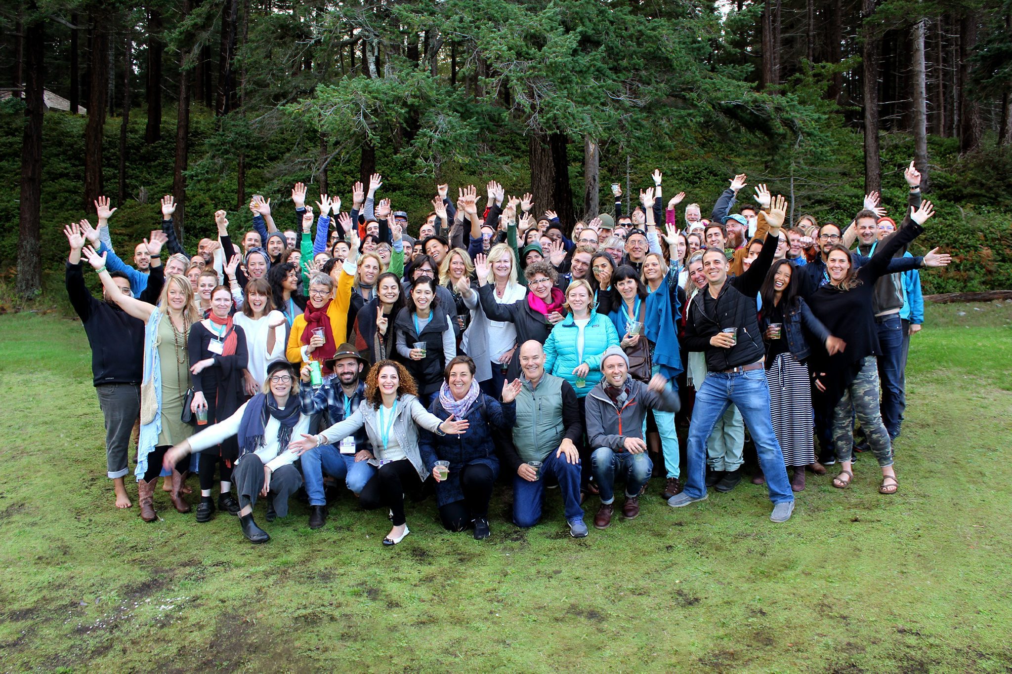 Happy group of people celebrating Hollyhock Leadership Institute.